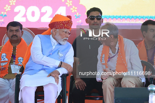 Prime Minister Narendra Modi is with Rajasthan BJP Jaipur Rural candidate Rao Rajendra Singh at a public meeting ahead of the Lok Sabha elec...