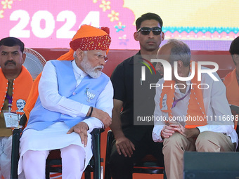 Prime Minister Narendra Modi is with Rajasthan BJP Jaipur Rural candidate Rao Rajendra Singh at a public meeting ahead of the Lok Sabha elec...