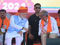 Prime Minister Narendra Modi is with Rajasthan BJP Jaipur Rural candidate Rao Rajendra Singh at a public meeting ahead of the Lok Sabha elec...