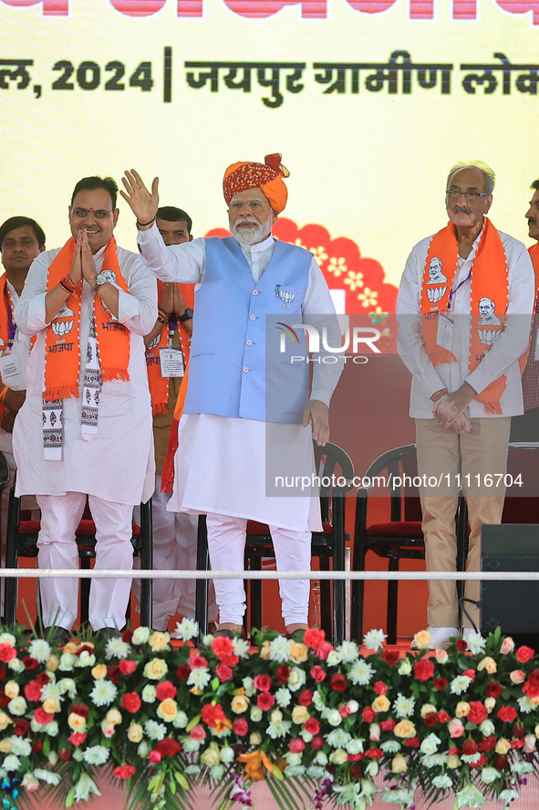 Prime Minister Narendra Modi is with Rajasthan Chief Minister Bhajan Lal Sharma, showing support for BJP Jaipur Rural candidate Rao Rajendra...