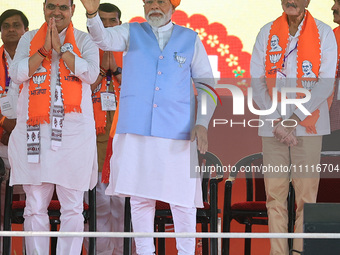 Prime Minister Narendra Modi is with Rajasthan Chief Minister Bhajan Lal Sharma, showing support for BJP Jaipur Rural candidate Rao Rajendra...