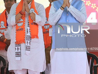 Prime Minister Narendra Modi is with Rajasthan Chief Minister Bhajan Lal Sharma at a public meeting ahead of the Lok Sabha election in Kotpu...