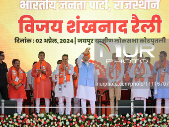 Prime Minister Narendra Modi is with Rajasthan Chief Minister Bhajan Lal Sharma at a public meeting in support of BJP Jaipur Rural candidate...