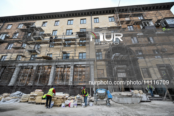 Workers are restoring an architectural monument, a five-story building that was partially destroyed by a Russian missile attack, in Zaporizh...