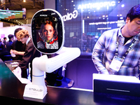 A robotic arm is displaying V.Stella, a Generative AI Hardware with a virtual assistant, at the SK Telecom pavilion at the Mobile World Cong...