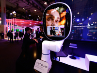 A robotic arm is displaying V.Stella, a Generative AI Hardware with a virtual assistant, at the SK Telecom pavilion at the Mobile World Cong...