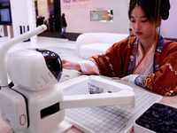 A woman is wearing traditional Chinese clothing and is playing Go with SenseRobot Go, a robot designed by SenseTime to play board games like...