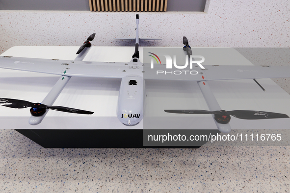 The CW-007, a portable integrated UAV platform drone by Chinese drone and UAV manufacturer JOUAV, is being exhibited in the China Mobile pav...