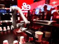 Ella, Singapore's first fully unmanned robot barista, is serving coffee at Etisalat's pavilion at the Mobile World Congress 2024 in Barcelon...