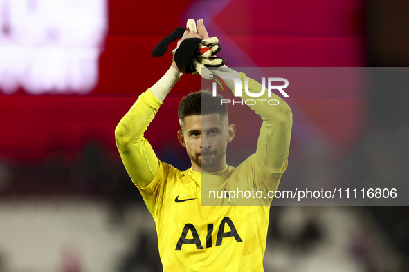 Guglielmo Vicario of Tottenham Hotspur is standing at the end of the game during the Premier League match between West Ham United and Totten...