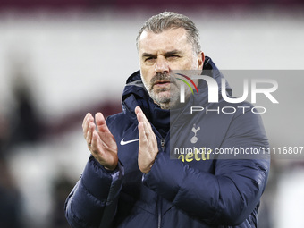 Ange Postecoglou, the manager of Tottenham Hotspur, is standing at the end of the game during the Premier League match between West Ham Unit...
