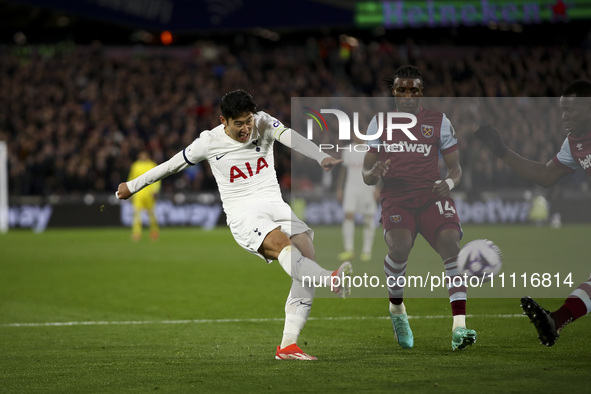 Son Heung-min is shooting at goal during the Premier League match between West Ham United and Tottenham Hotspur at the London Stadium in Str...
