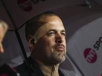 Joe Cole is serving as a football pundit during the Premier League match between West Ham United and Tottenham Hotspur at the London Stadium...