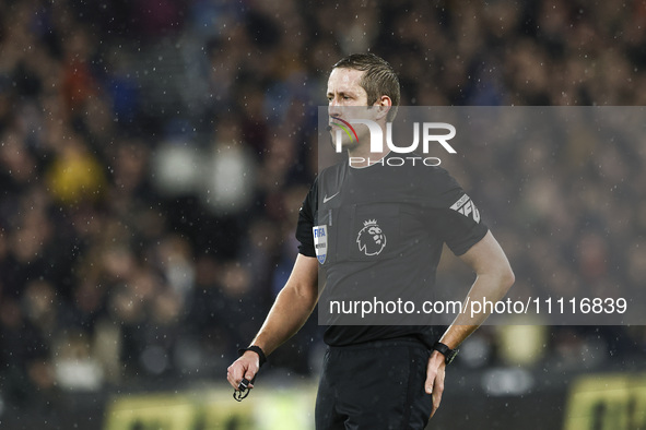 Match referee John Brooks is officiating the Premier League match between West Ham United and Tottenham Hotspur at the London Stadium in Str...