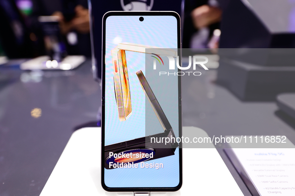 The Nubia Flip 5G, a horizontally folding smartphone developed by the Chinese manufacturer and former ZTE subsidiary, is being displayed in...