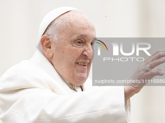 Pope Francis is gesturing as he arrives to lead the weekly general audience in St. Peter's Square at the Vatican on April 3, 2024. (