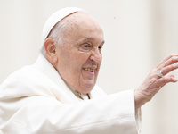 Pope Francis is gesturing as he arrives to lead the weekly general audience in St. Peter's Square at the Vatican on April 3, 2024. (