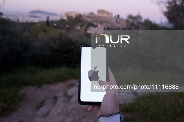 The Apple logo is displayed on a smartphone screen in Athens, Greece, on April 3, 2024. (Photo Illustration by Nikolas Kokovlis/NurPhoto)