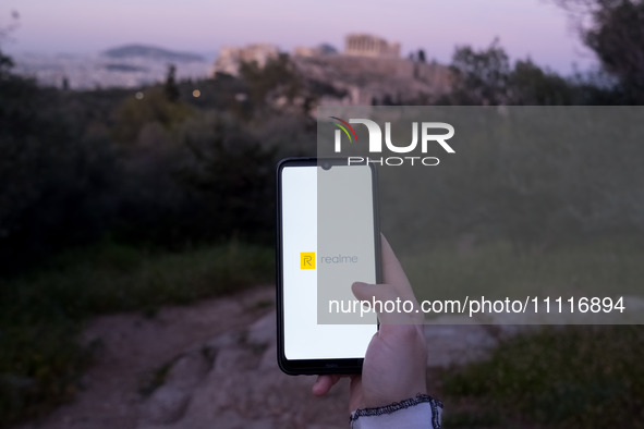 The Realme logo is displayed on a smartphone screen in Athens, Greece, on April 3, 2024. (Photo Illustration by Nikolas Kokovlis/NurPhoto)