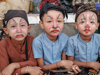 Children are joining the spectacle, their faces and bodies painted to embody mythical beings, adding a playful spirit to the ceremony, on Ap...