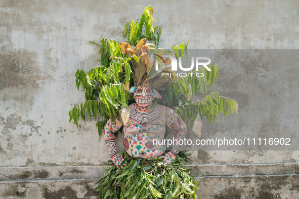 Gede Pasek, aged 32, is adorning himself in colors and patterns that mimic the lush forests of Bali, symbolizing the mystical hideaways of s...