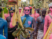The people in Tegallalang are embracing a kaleidoscope of colors, painting their bodies to celebrate diversity and unity in the Ngerebeg cer...