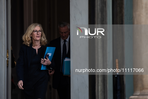 Minister of National Education Nicole Belloubet is leaving the Council of Ministers, with the Minister of the Economy Bruno Le Maire visible...