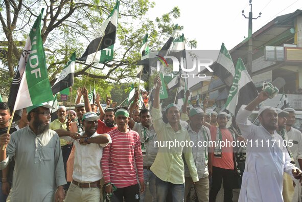 Supporters of the All India United Democratic Front (AIUDF) are attending a rally for party candidate Aminul Islam as he prepares to file hi...
