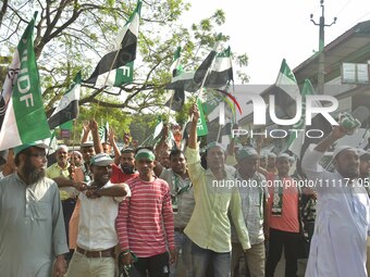 Supporters of the All India United Democratic Front (AIUDF) are attending a rally for party candidate Aminul Islam as he prepares to file hi...