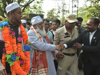 Badruddin Ajmal, the chief of the All India United Democratic Front (AIUDF), is attending a rally with Aminul Islam, the party's candidate f...