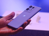 A media person is holding the new Motorola Edge 50 Pro smartphone at its launch event in New Delhi, India, on April 3, 2024. (