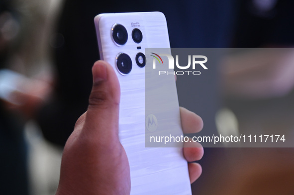 A media person is holding the new Motorola Edge 50 Pro smartphone at its launch event in New Delhi, India, on April 3, 2024. 