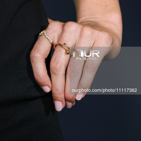 Elizabeth Gilpin wearing Prada (jewelry detail) arrives at the Los Angeles Special Screening Of A24's 'Civil War' held at the Academy Museum...