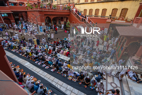 Muslim devotees are gathering at the Nakhoda Mosque as they prepare to break their fast with their Iftar meal at sunset during the Holy mont...