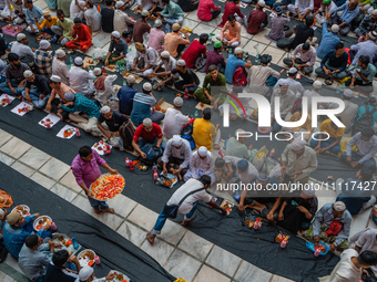 Muslim devotees are gathering at the Nakhoda Mosque as they prepare to break their fast with their Iftar meal at sunset during the Holy mont...