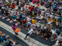 Muslim devotees are gathering at the Nakhoda Mosque as they prepare to break their fast with their Iftar meal at sunset during the Holy mont...