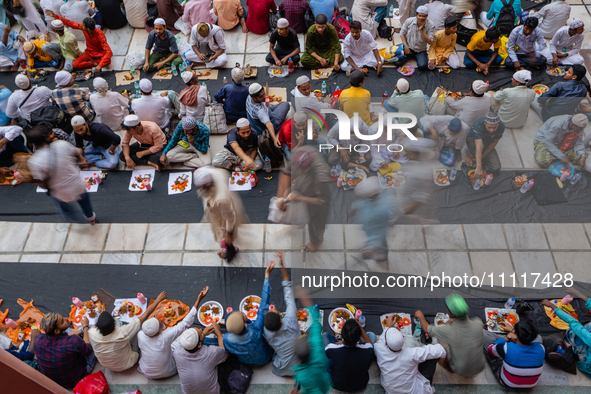 Muslim devotees are gathering at the Nakhoda Mosque as they prepare to break their fast with their Iftar meal at sunset during the Holy mont...