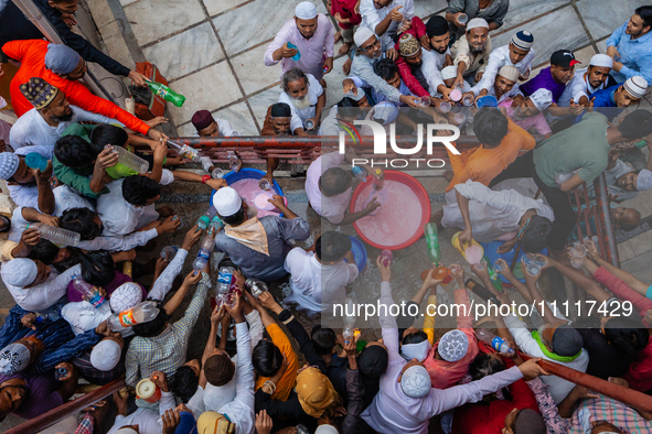 Muslim devotees are gathering at the Nakhoda Mosque as they prepare to break their fast with their Iftar meal at sunset during the Holy mont...