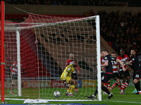 Paul Mullin of Wrexham is scoring a goal that is being disallowed during the Sky Bet League 2 match between Doncaster Rovers and Wrexham at...