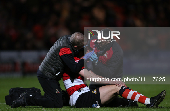 Richard Wood is undergoing treatment during the Sky Bet League 2 match between Doncaster Rovers and Wrexham at the Keepmoat Stadium in Donca...