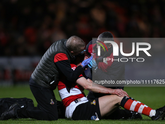 Richard Wood is undergoing treatment during the Sky Bet League 2 match between Doncaster Rovers and Wrexham at the Keepmoat Stadium in Donca...