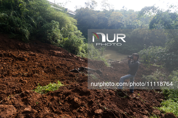 A car is plunging into a ravine after a landslide disaster on the Bogor-Ciawi-Sukabumi (Bocimi) toll road in Bogor, Indonesia, on April 4, 2...