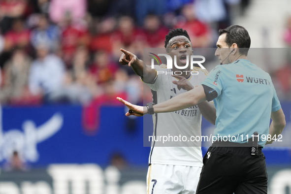 Vinicius Junior left winger of Real Madrid and Brazil protest to referee during the LaLiga EA Sports match between CA Osasuna and Real Madri...