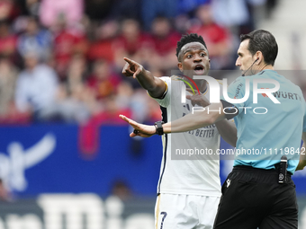 Vinicius Junior left winger of Real Madrid and Brazil protest to referee during the LaLiga EA Sports match between CA Osasuna and Real Madri...