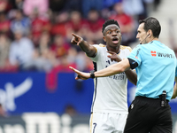 Vinicius Junior left winger of Real Madrid and Brazil protest to referee during the LaLiga EA Sports match between CA Osasuna and Real Madri...