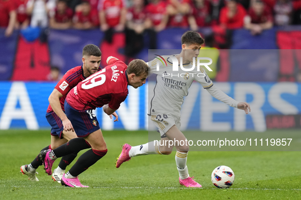 Arda Guler attacking midfield of Real Madrid and Turkey and Pablo Ibañez central midfield of Osasuna and Spain compete for the ball during t...