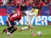 Arda Guler attacking midfield of Real Madrid and Turkey and Pablo Ibañez central midfield of Osasuna and Spain compete for the ball during t...