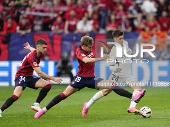 Arda Guler attacking midfield of Real Madrid and Turkey and Pablo Ibañez central midfield of Osasuna and Spain compete for the ball during t...