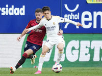 Arda Guler attacking midfield of Real Madrid and Turkey and Iker Muñoz defensive midfield of Osasuna and Spain compete for the ball during t...