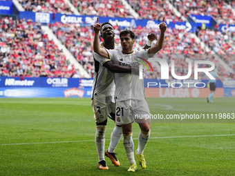 Brahim Diaz attacking midfield of Real Madrid and Spain celebrates with Vinicius Junior left winger of Real Madrid and Brazil after scoring...